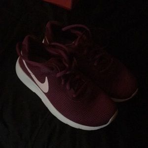 Nike kids size 4.5 shoes. Maroon and white in color. New, never worn